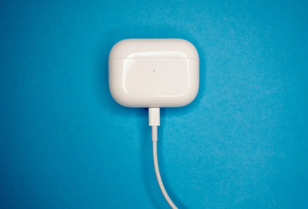 white charging adapter on blue textile