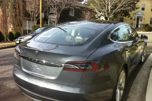 Why Tesla Owners Tap The Cars Tail Light? (Before Charging)