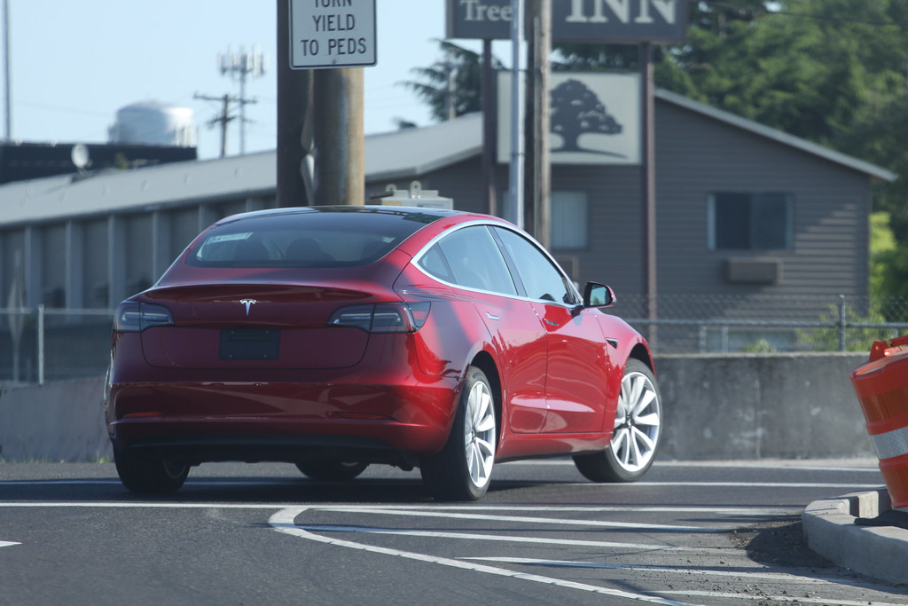 Red Tesla Driving