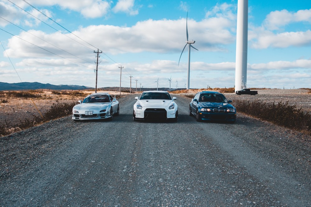 cars under wind turbine