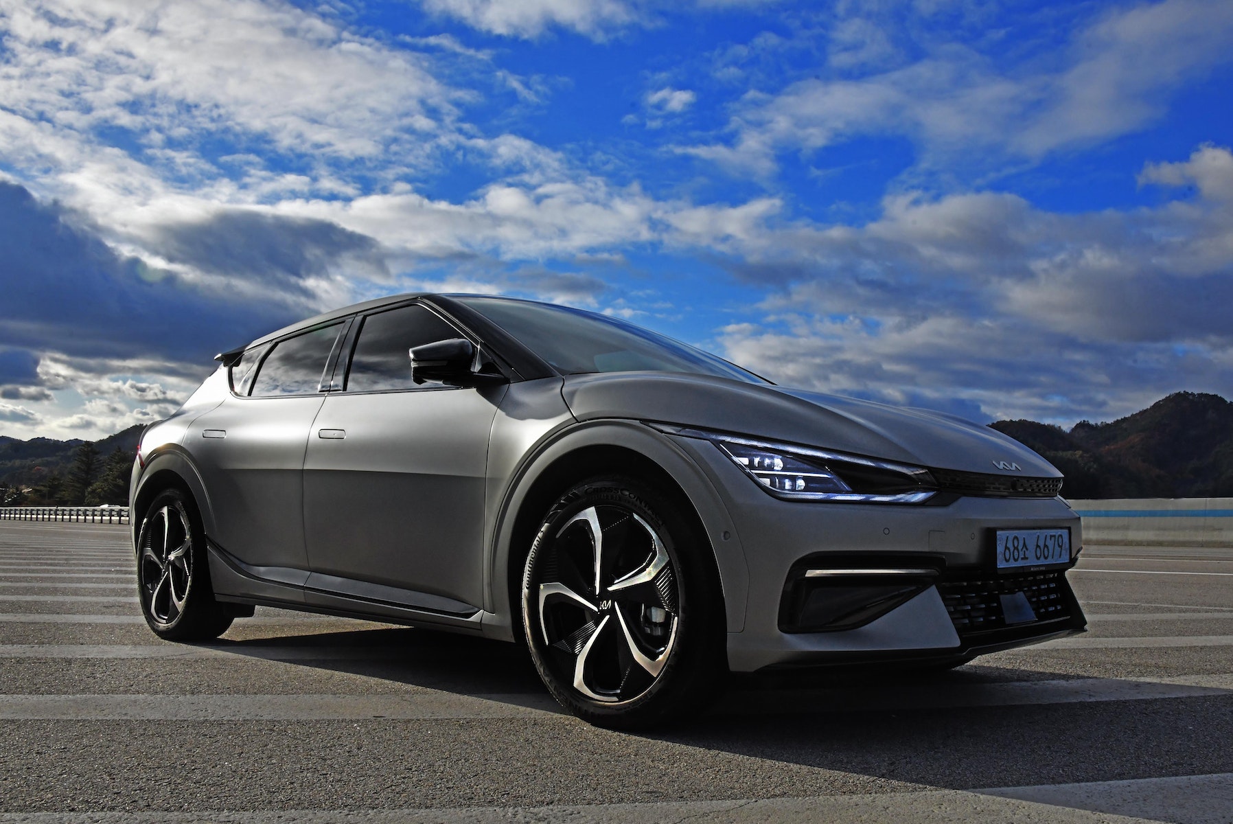 Photo of a Car Under a Cloudy Sky