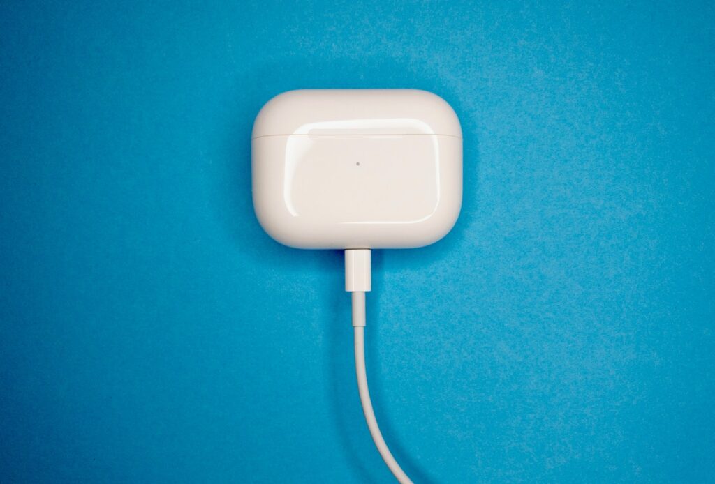 white charging adapter on blue textile